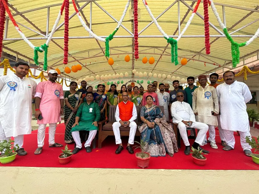 Staff assembled under the canopy
