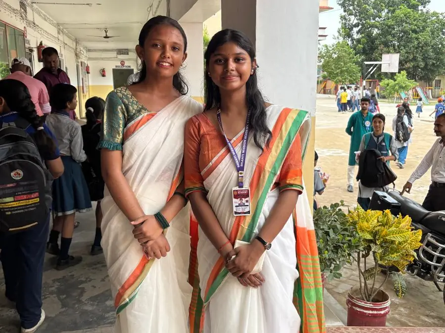 Two teachers in tricolour